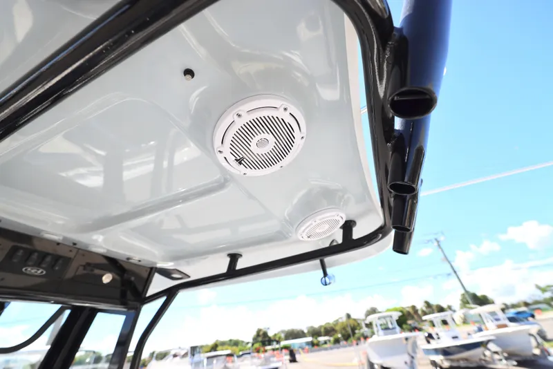 Slide: The Image of 2025 Sea Hunt Ultra 239 SE boat roof with speakers and rod holders. - 10