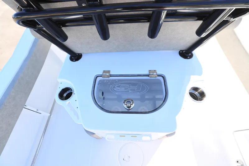 Slide: The Image of 2025 Sea Hunt Ultra 239 SE boat interior with storage compartment and cup holders. - 11