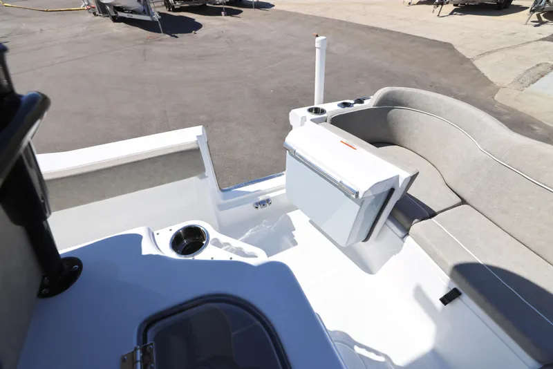 Slide: The Image of 2025 Sea Hunt Ultra 239 SE boat interior with seating and storage features. - 13