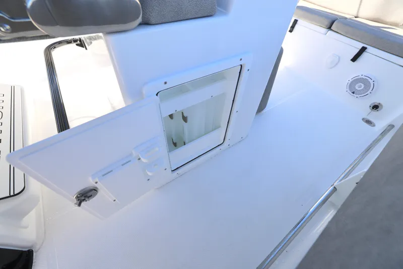 Slide: The Image of 2025 Sea Hunt Ultra 239 SE boat interior with storage compartment and seating area. - 14