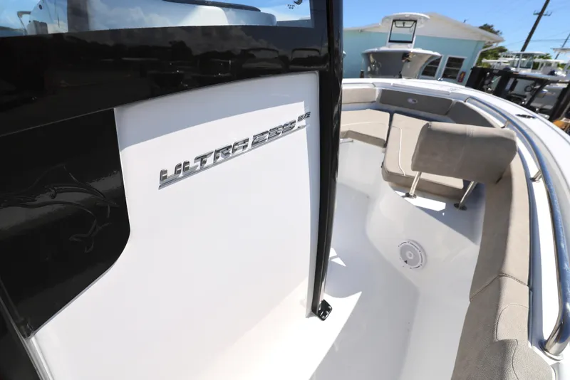 Slide: The Image of 2025 Sea Hunt Ultra 239 SE boat interior with seating and branding. - 17
