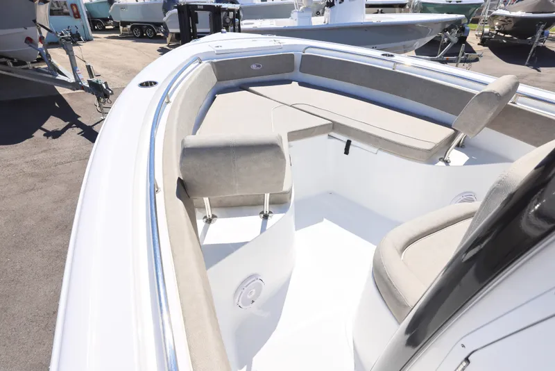 Slide: The Image of 2025 Sea Hunt Ultra 239 SE boat interior with cushioned seating and sleek design. - 19