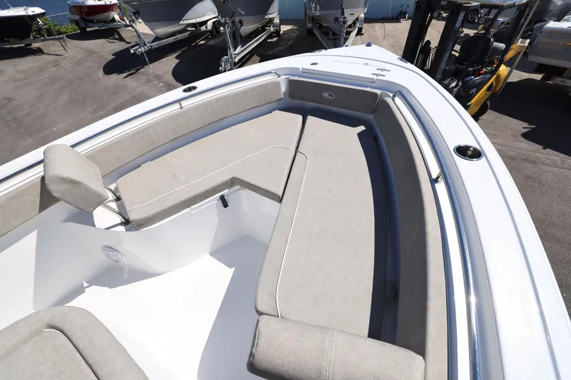 Slide: The Image of 2025 Sea Hunt Ultra 239 SE boat with spacious seating and sleek design. - 3