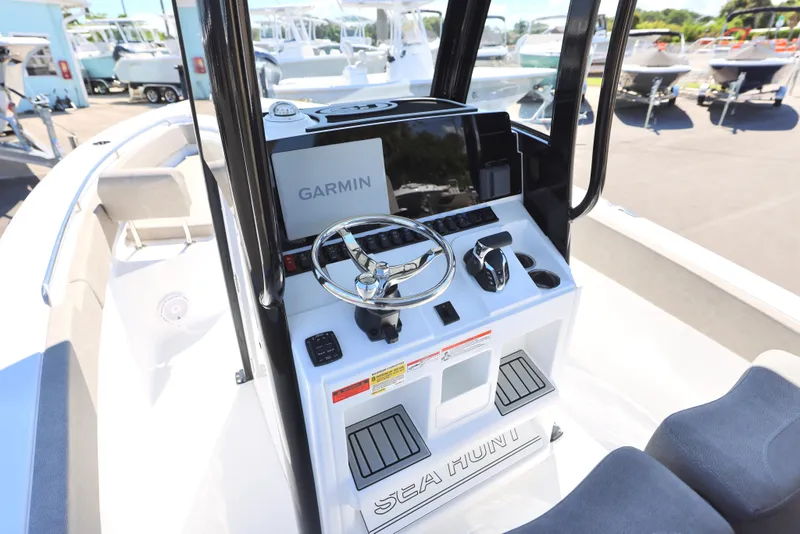 Slide: The Image of 2025 Sea Hunt Ultra 239 SE boat console with Garmin navigation system. - 5