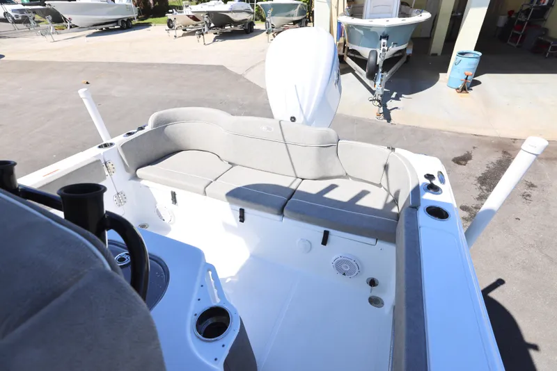Slide: The Image of 2025 Sea Hunt Ultra 239 SE boat interior with cushioned seating and storage compartments. - 6