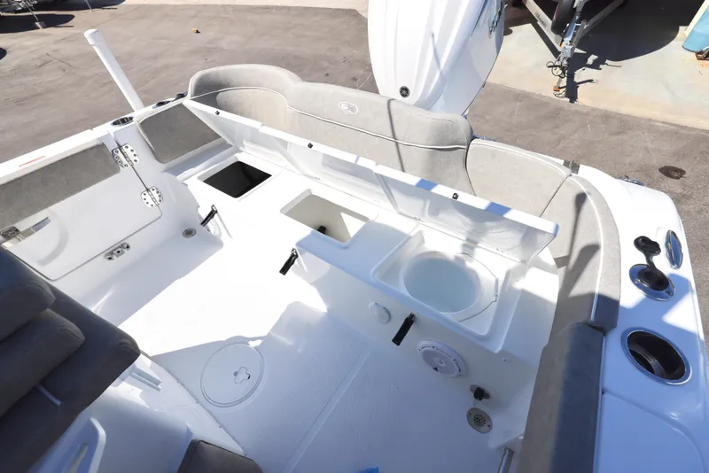 Slide: The Image of 2025 Sea Hunt Ultra 239 SE boat interior with seating and storage compartments. - 8