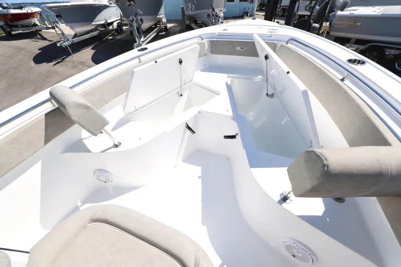 Slide: The Image of 2025 Sea Hunt Ultra 239 SE boat interior with cushioned seating and storage compartments. - 9