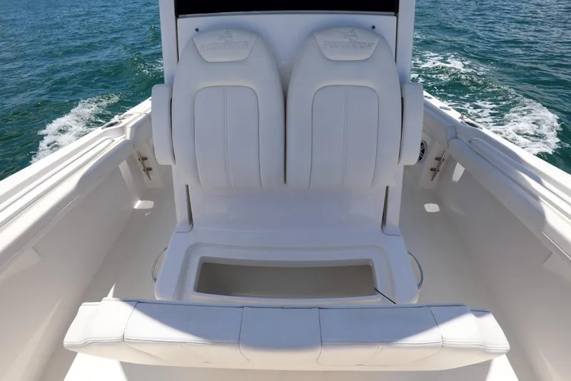 Slide: The Image of 2024 Regulator 23 boat interior with white seating, on open water. - 10