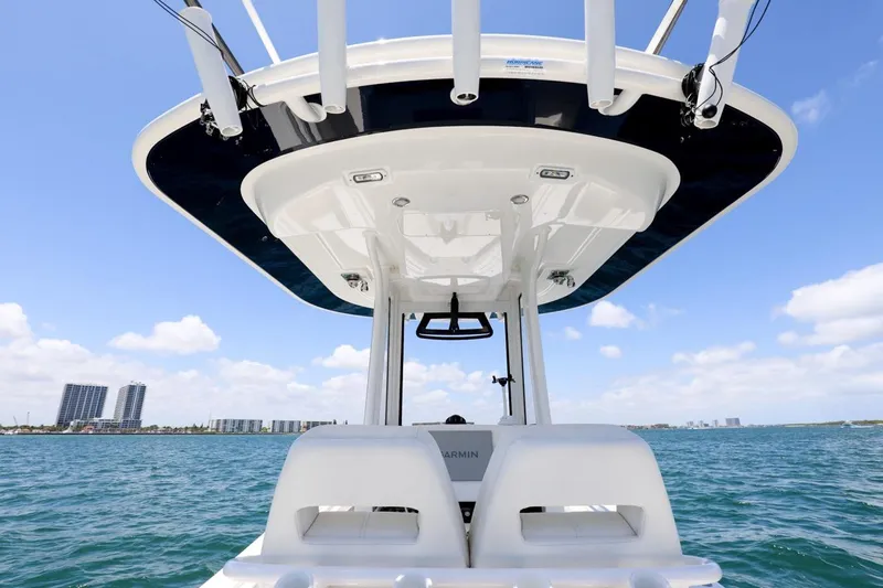 Slide: The Image of 2024 Regulator 23 boat on water, featuring sleek design and modern amenities. - 20