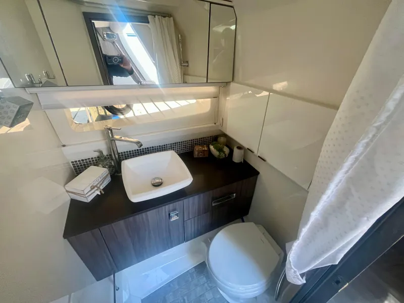 Slide: The Image of Luxurious bathroom in 2018 Sea Ray SLX 400 yacht with modern sink and toilet. - 12