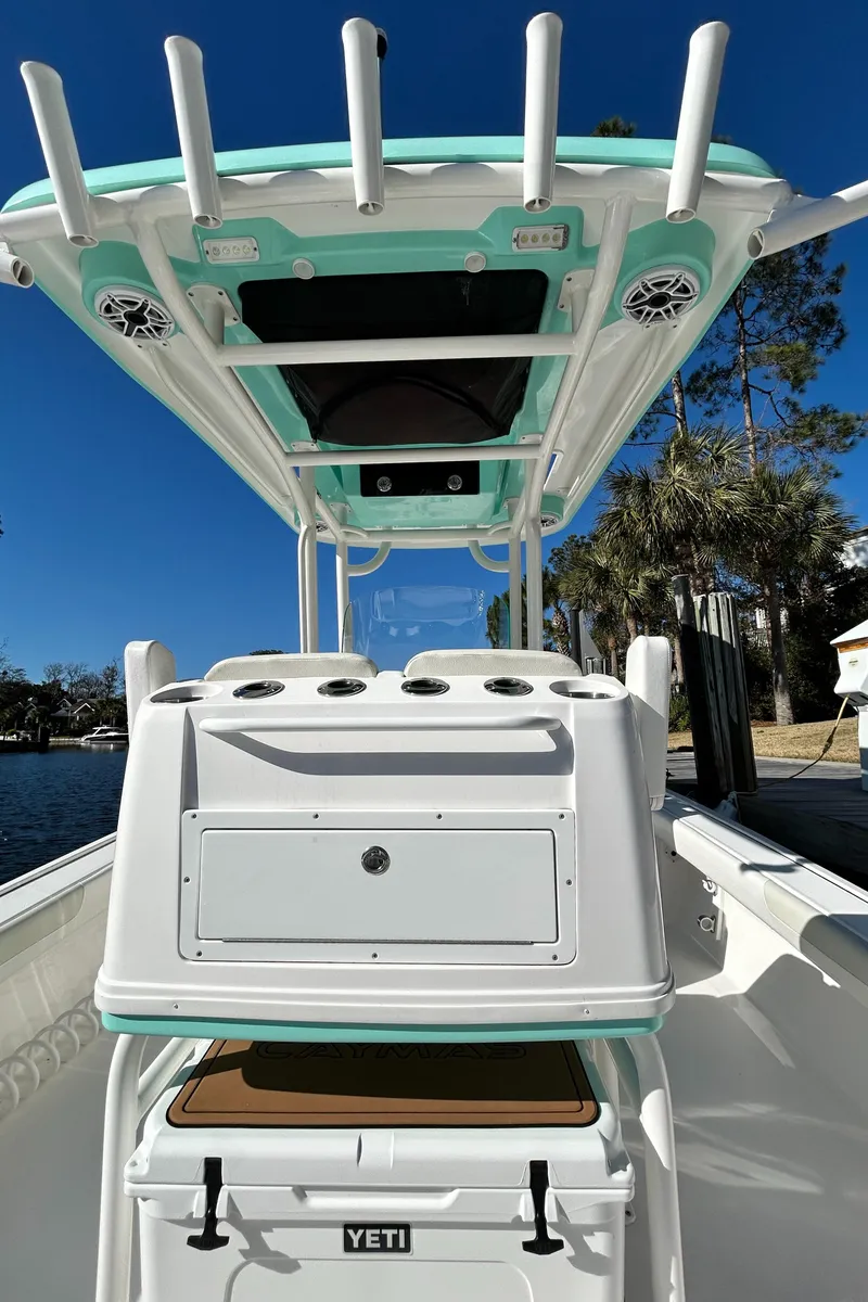 Slide: The Image of 2021 Caymas 28 HB boat interior with Yeti cooler and overhead speakers. - 11