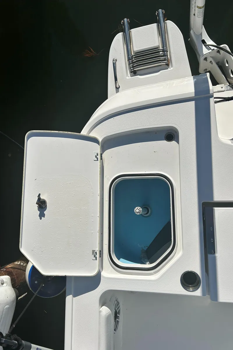 Slide: The Image of 2021 Caymas 28 HB boat deck with open hatch and ladder. - 17