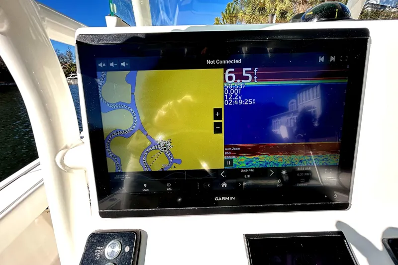 Slide: The Image of Garmin navigation display on 2021 Caymas 28 HB boat, showing depth and map details. - 23
