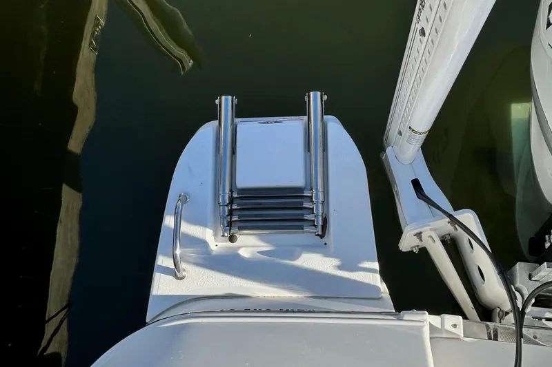 Slide: The Image of 2021 Caymas 28 HB boat with a folded swim ladder on the deck. - 33