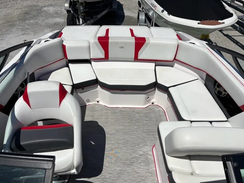 Slide: The Image of 2016 Regal 2000 ESX Bowrider interior with white and red seating, spacious layout. - 13