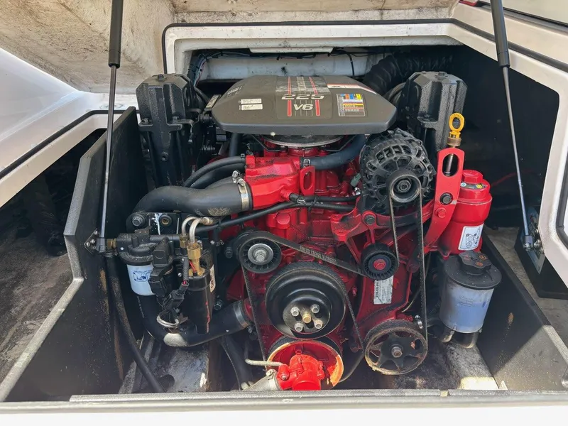 Slide: The Image of Engine compartment of a 2016 Regal 2000 ESX Bowrider boat, showcasing a V8 engine. - 16