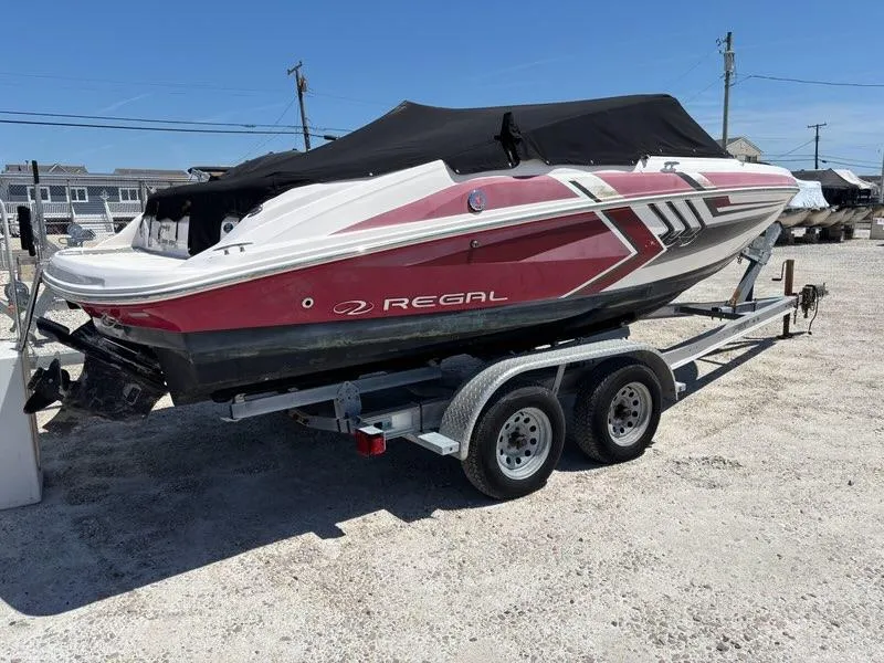 Slide: The Image of 2016 Regal 2000 ESX Bowrider on trailer, covered, parked outdoors. - 3