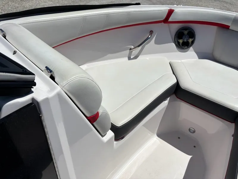 Slide: The Image of 2016 Regal 2000 ESX Bowrider interior with white seating and red accents. - 6