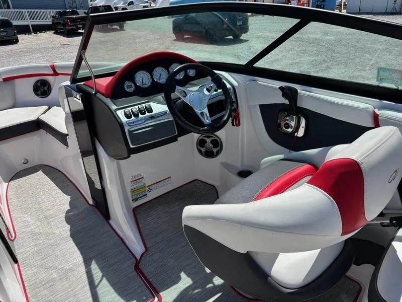 Slide: The Image of 2016 Regal 2000 ESX Bowrider interior with modern dashboard and steering wheel. - 9