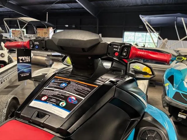 Slide: The Image of 2024 Yamaha WaveRunner VX Deluxe with red handlebars in a showroom. - 10