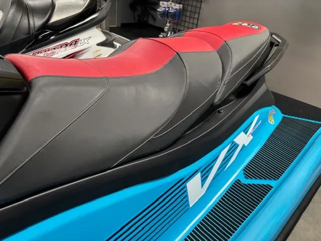 Slide: The Image of 2024 Yamaha WaveRunner VX Deluxe with red and black seat, blue body, and sleek design. - 4