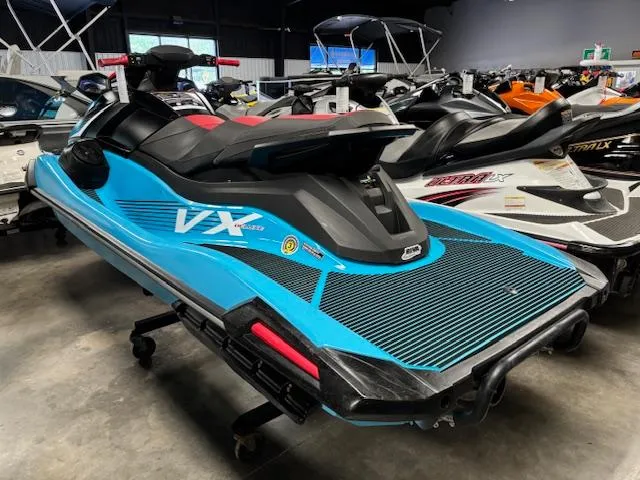 Slide: The Image of 2024 Yamaha WaveRunner VX Deluxe in showroom, featuring sleek blue design and advanced features. - 5