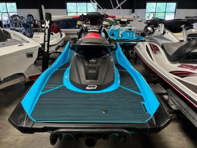 Slide: The Image of 2024 Yamaha WaveRunner VX Deluxe in showroom, featuring sleek blue and black design. - 6