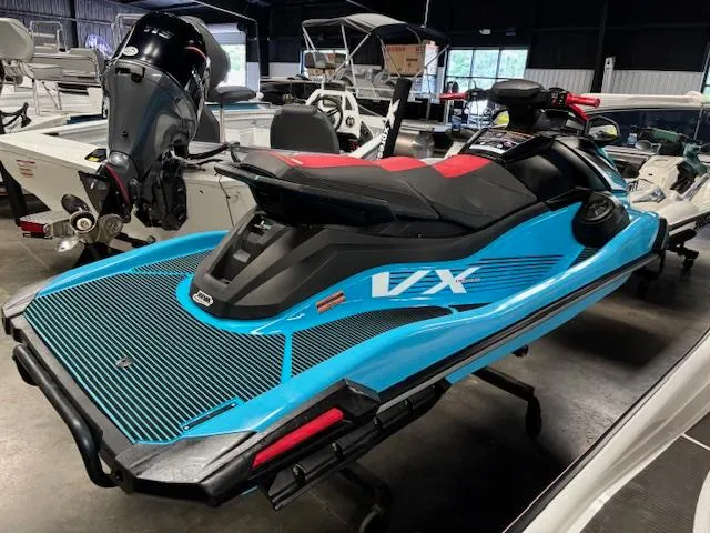 Slide: The Image of 2024 Yamaha WaveRunner VX Deluxe in showroom, featuring sleek blue and black design. - 9