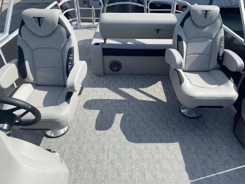 Slide: The Image of 2025 Trifecta LE Series 22UL boat interior with plush seating and modern design. - 16