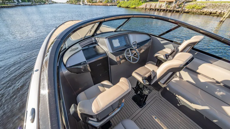 Slide: The Image of Luxurious 2022 Wajer boat interior with modern dashboard and comfortable seating on a serene waterway. - 4