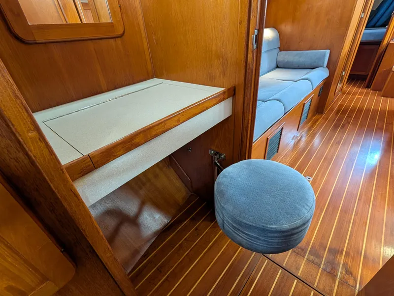 Slide: The Image of Interior of 1998 Caliber 40 LRC yacht with wooden flooring and seating area. - 13