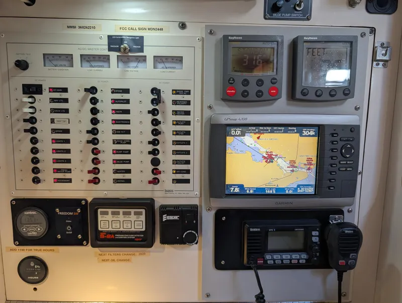 Slide: The Image of Control panel of a 1998 Caliber 40 LRC yacht with navigation and communication equipment. - 23