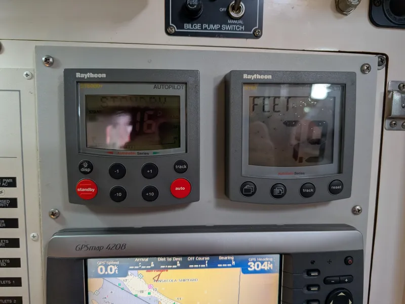 Slide: The Image of Control panel of a 1998 Caliber 40 LRC with Raytheon autopilot and GPS display. - 25