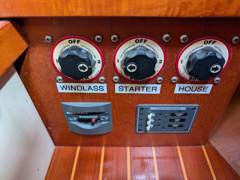 Slide: The Image of Control panel of a 1998 Caliber 40 LRC boat with switches for windlass, starter, and house. - 29