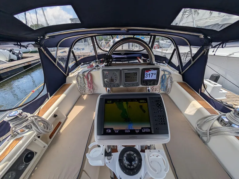 Slide: The Image of Cockpit of 1998 Caliber 40 LRC sailboat with navigation equipment and steering wheel. - 36