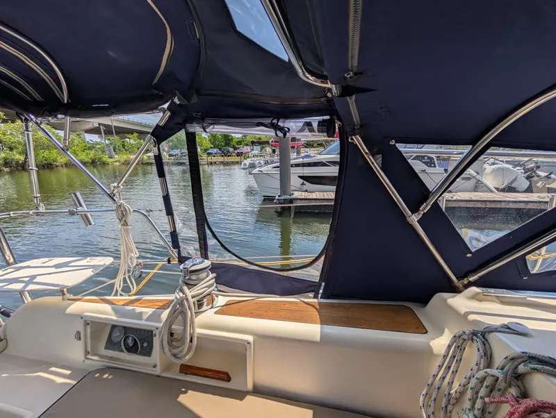 Slide: The Image of Interior view of 1998 Caliber 40 LRC sailboat with marina backdrop. - 42