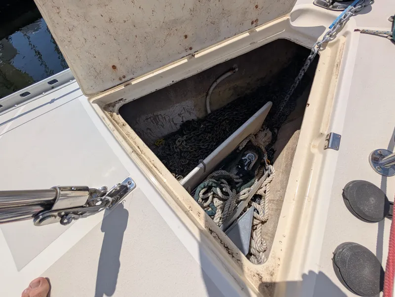 Slide: The Image of Open anchor locker on 1998 Caliber 40 LRC sailboat, showing ropes and chains. - 47