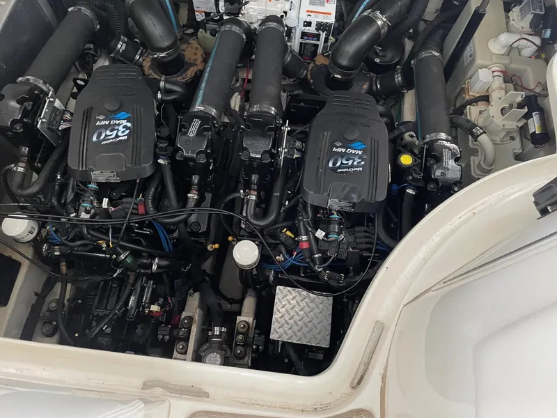 Slide: The Image of Engine compartment of a 2007 Sea Ray 320 Sundancer boat, showcasing dual engines. - 12