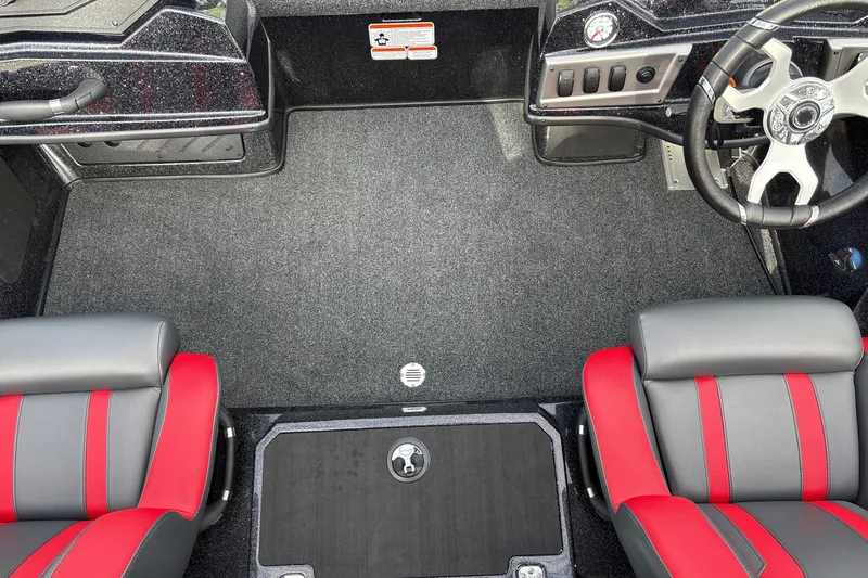 Slide: The Image of Interior of 2025 Nitro Z19 Pro boat with red and gray seating and steering wheel. - 14