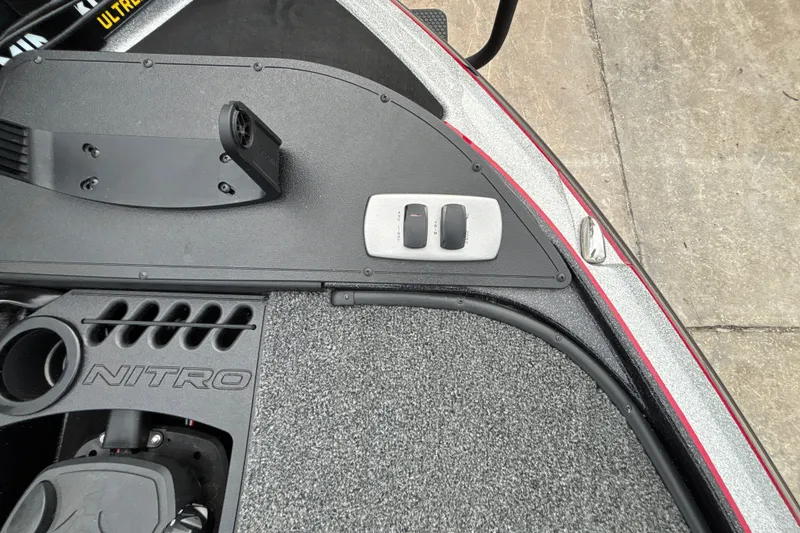Slide: The Image of Nitro Z19 Pro 2025 boat interior with control panel and textured flooring. - 31