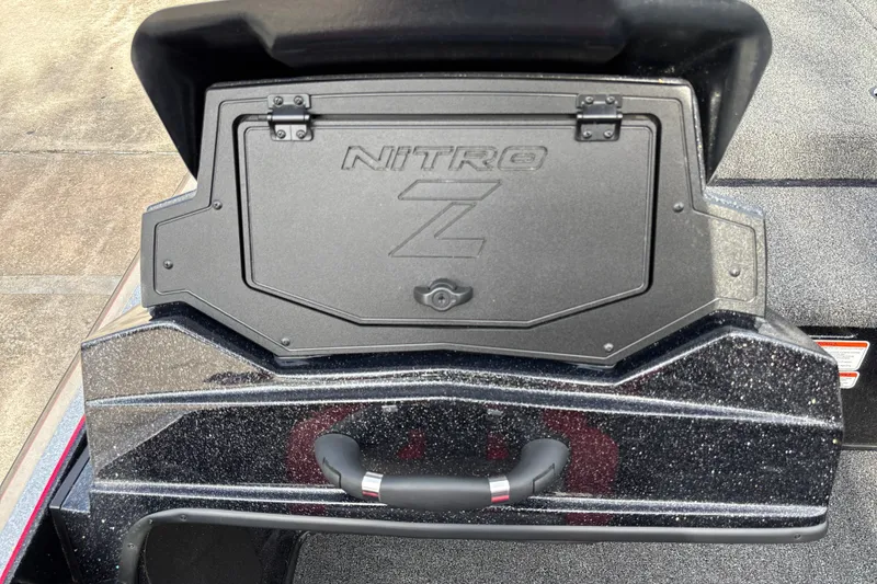 Slide: The Image of 2025 Nitro Z19 Pro boat compartment with sleek black finish and secure latch. - 19