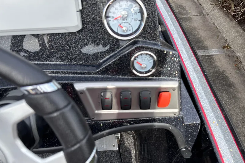 Slide: The Image of Dashboard of a 2025 Nitro Z19 Pro boat with gauges and switches. - 17