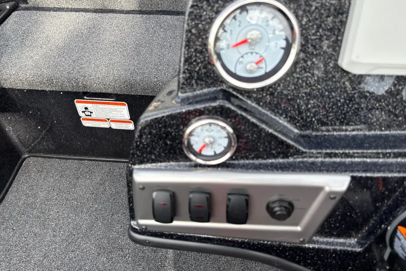 Slide: The Image of Dashboard of a 2025 Nitro Z19 Pro boat with gauges and switches. - 18