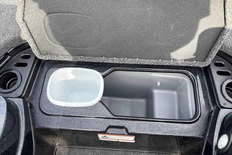 Slide: The Image of 2025 Nitro Z19 Pro storage compartment with cup holders and open lid. - 25