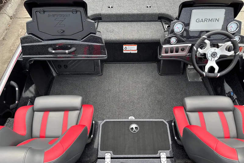 Slide: The Image of Interior of 2025 Nitro Z19 Pro boat with Garmin display and red-gray seats. - 13