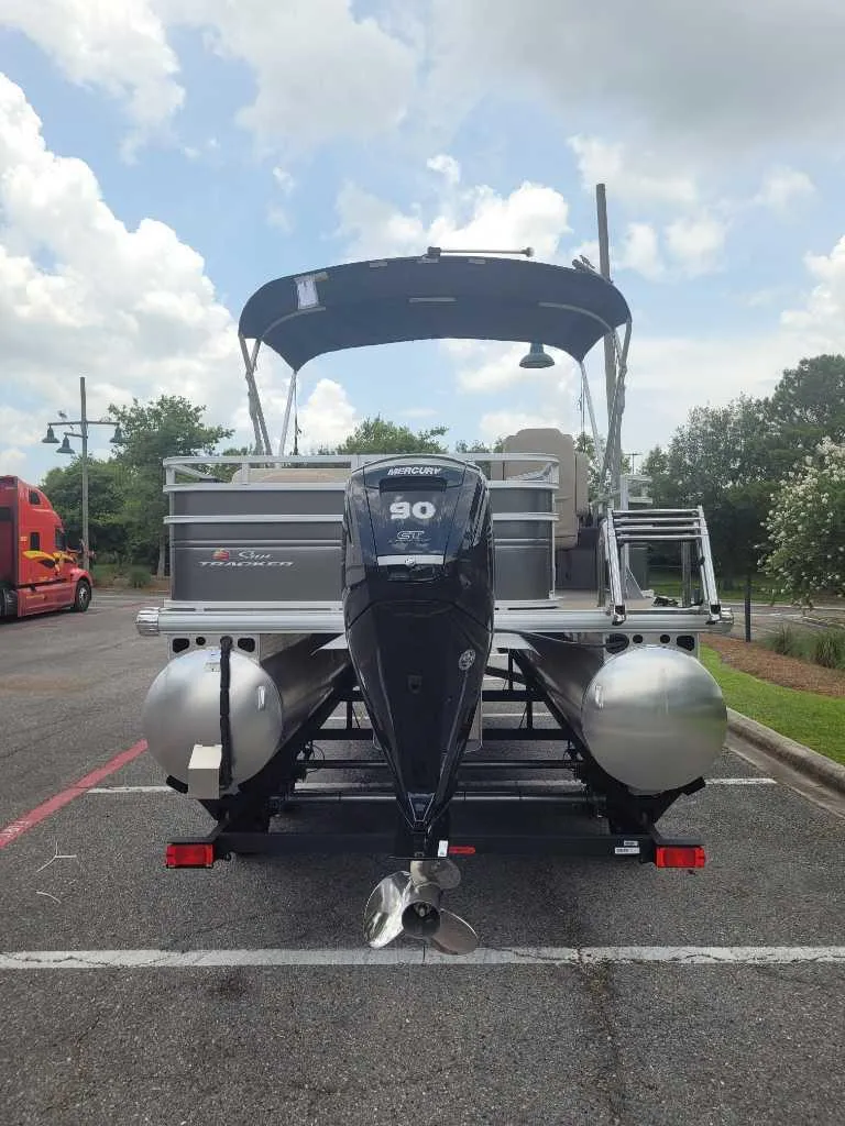 Slide: The Image of 2025 Sun Tracker Fishin' Barge 20 DLX pontoon boat with Mercury outboard motor. - 6