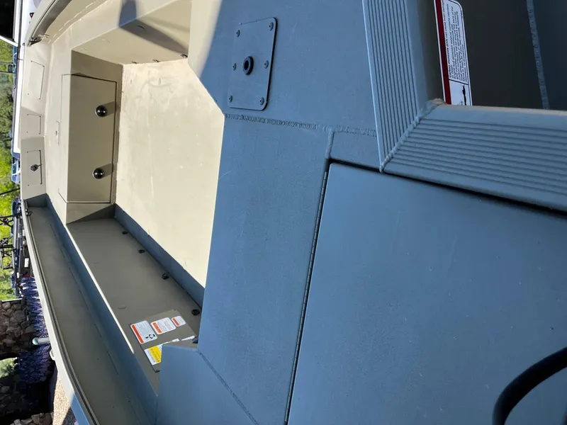 Slide: The Image of 2025 Tracker Grizzly 1650 T Prairie Wings Edition boat interior, showcasing seating and storage areas. - 3