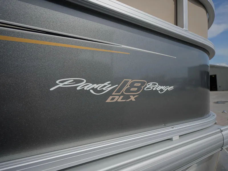Slide: The Image of 2025 Sun Tracker Party Barge 18 DLX pontoon boat side view. - 12