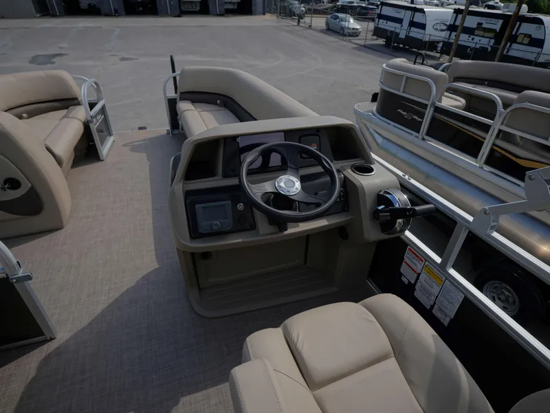Slide: The Image of 2025 Sun Tracker Party Barge 18 DLX interior with steering console and seating. - 6