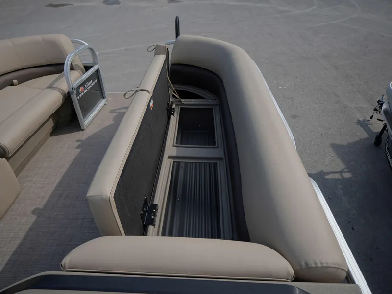 Slide: The Image of 2025 Sun Tracker Party Barge 18 DLX interior seating with storage compartments. - 7